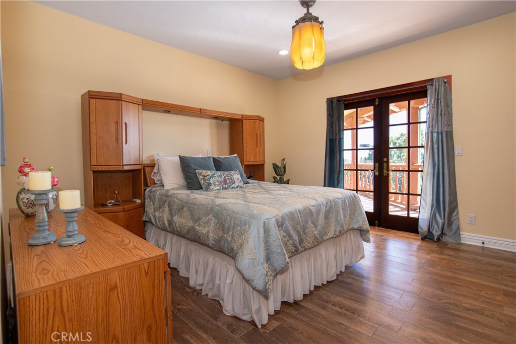 10425 Melvin Avenue Porter Ranch, CA 91326 - Photo 55 of 61 a bedroom with a bed and a chandelier