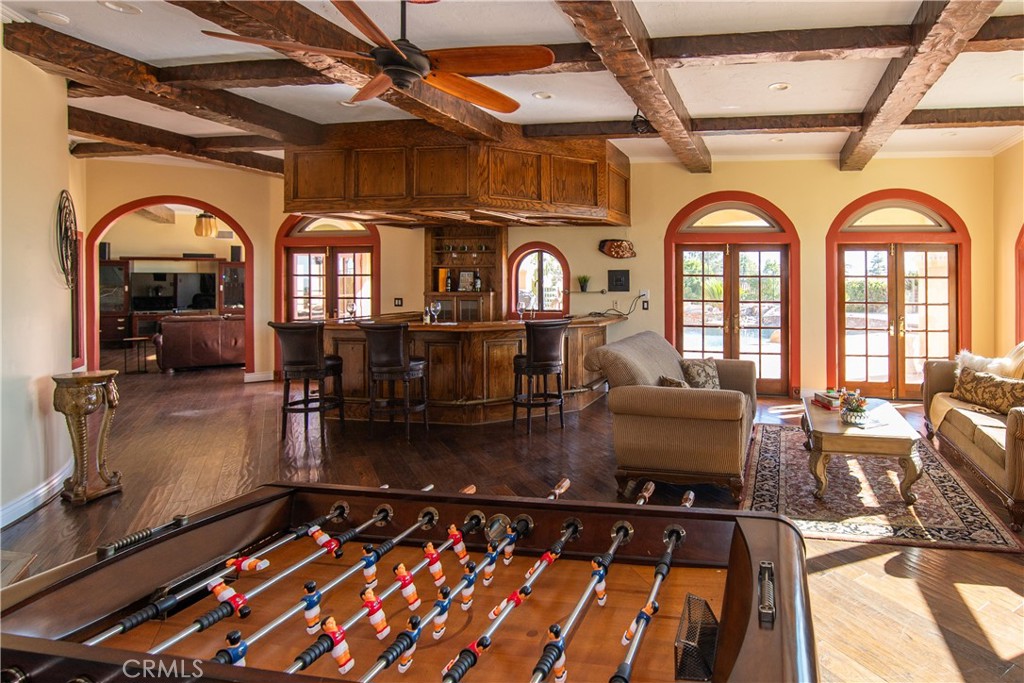 10425 Melvin Avenue Porter Ranch, CA 91326 - Photo 6 of 61 a room with lots of furniture and a chandelier