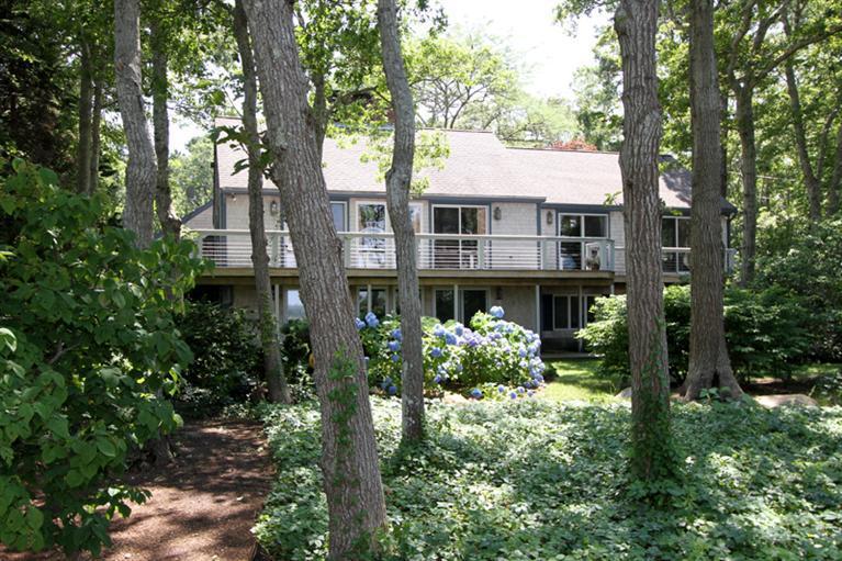 505 Scraggy Neck Road Cataumet, MA 02534 - Photo 1 of 33 a front view of a house with yard and green space