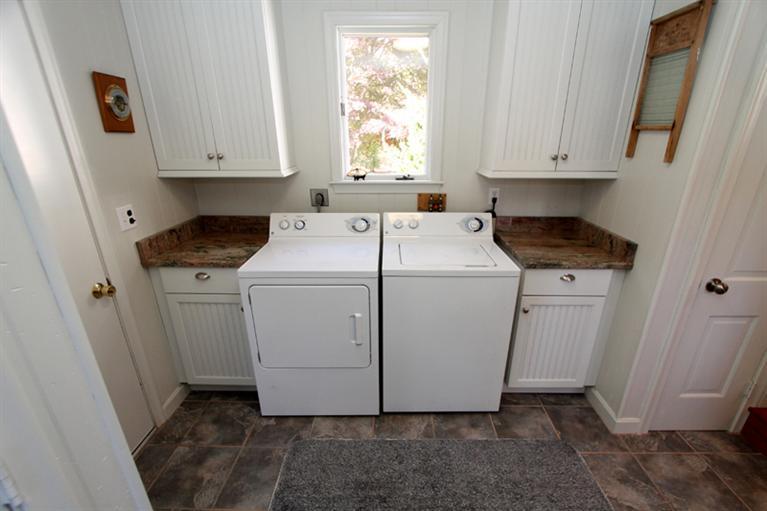 505 Scraggy Neck Road Cataumet, MA 02534 - Photo 12 of 33 a utility room with dryer and washer