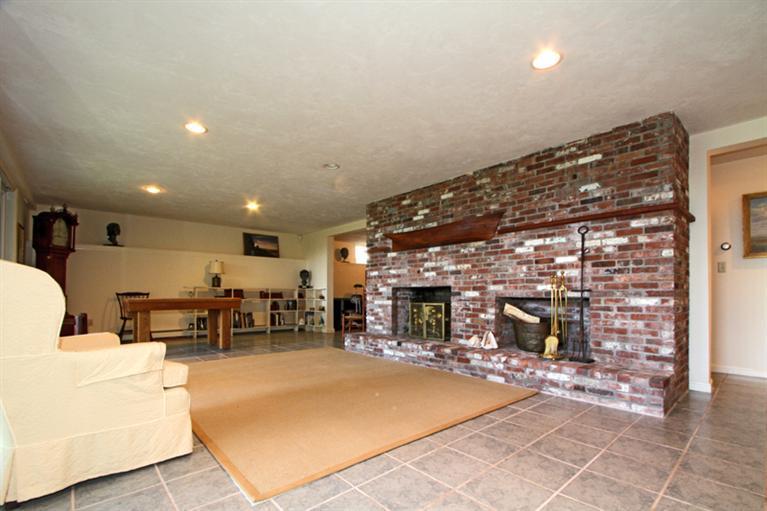 505 Scraggy Neck Road Cataumet, MA 02534 - Photo 19 of 33 a lobby with furniture and a fireplace