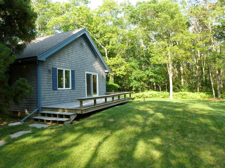 505 Scraggy Neck Road Cataumet, MA 02534 - Photo 21 of 33 a view of a house with a yard and sitting area