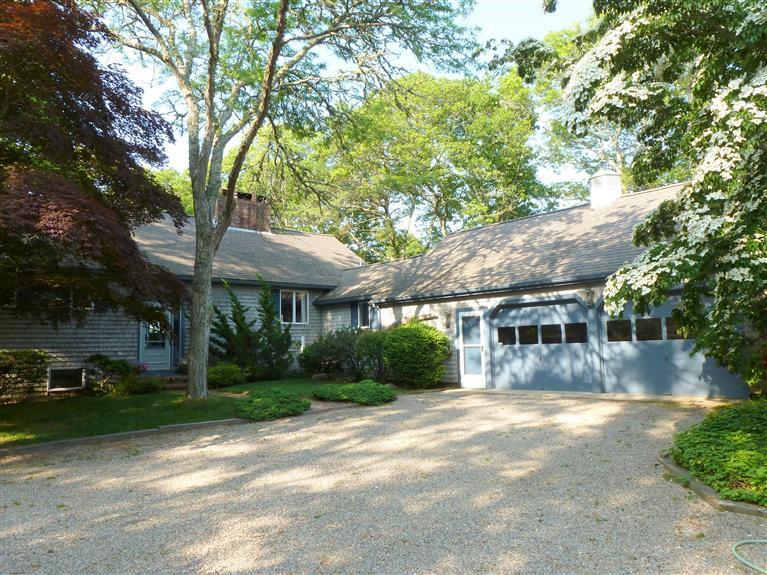 505 Scraggy Neck Road Cataumet, MA 02534 - Photo 31 of 33 a front view of a house with a yard and shrubs
