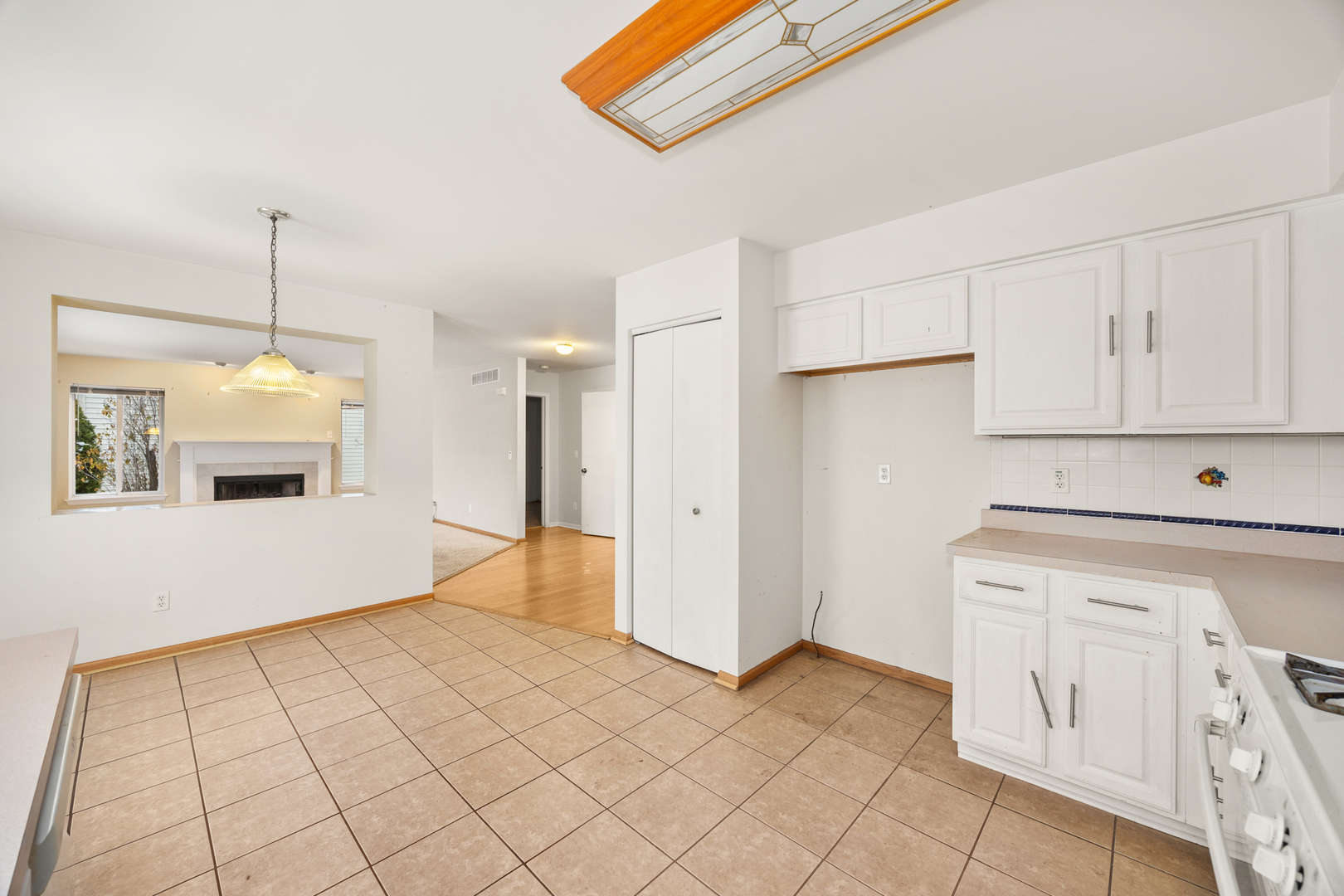 14252 South Hemingway Circle Plainfield, IL 60544 - Photo 16 of 36 a view of a kitchen with white cabinets