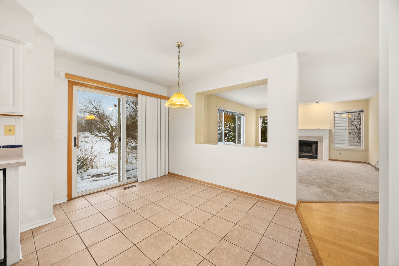 14252 South Hemingway Circle Plainfield, IL 60544 - Photo 18 of 36 a view of an empty room with window and chandelier