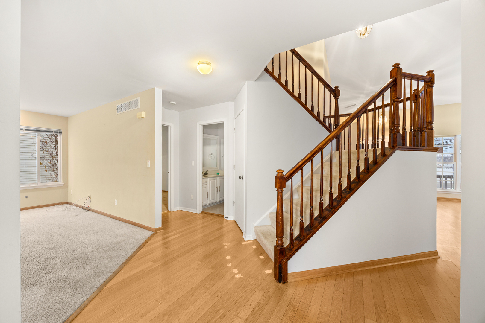14252 South Hemingway Circle Plainfield, IL 60544 - Photo 21 of 36 a view of a hallway with staircase