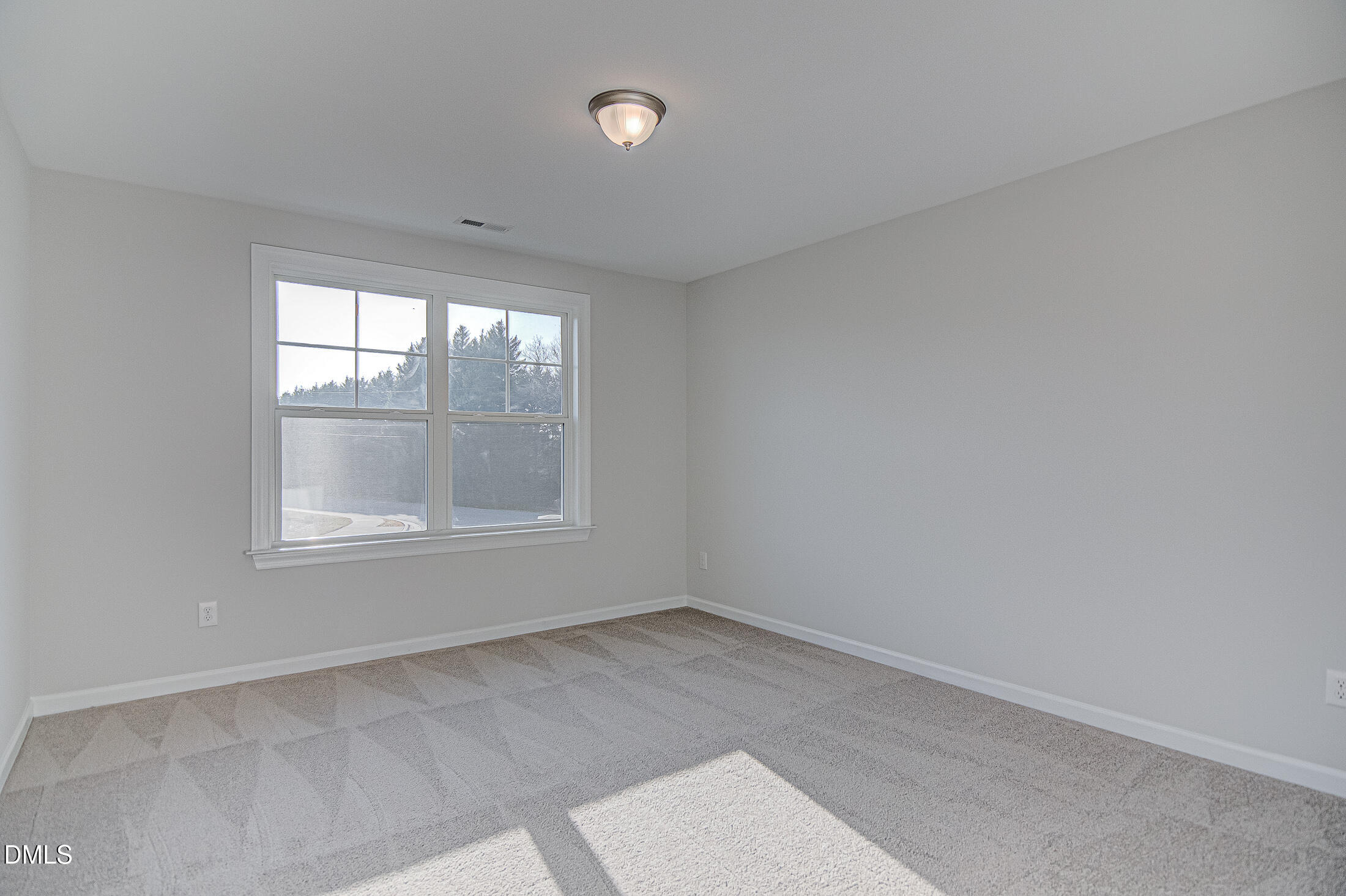 108 Starlet Ridge Way Clayton, NC 27520 - Photo 24 of 33 an empty room with windows