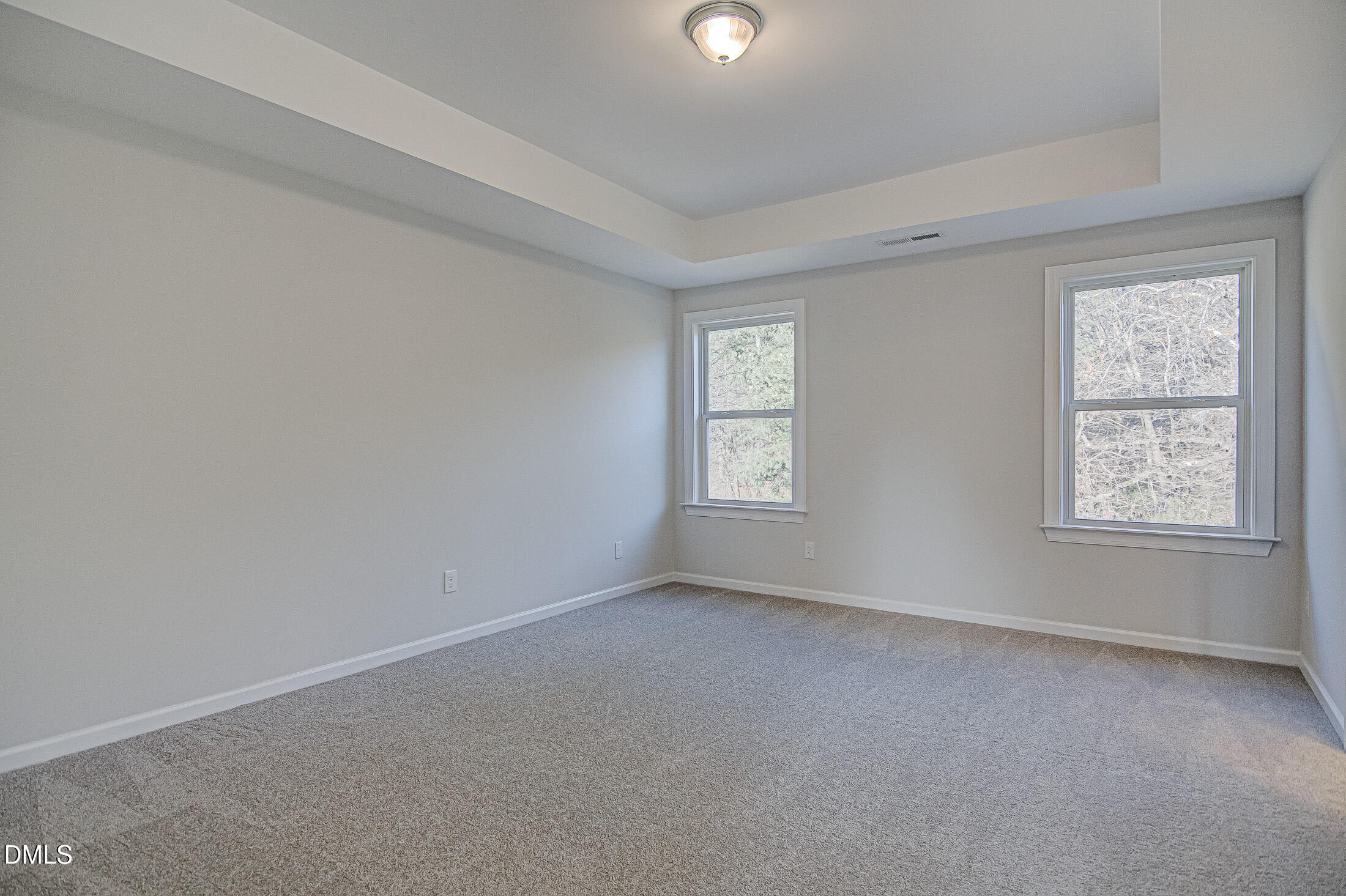 108 Starlet Ridge Way Clayton, NC 27520 - Photo 30 of 33 an empty room with windows
