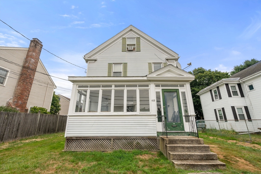 102 Maple Street Needham, MA 02492 - Photo 2 of 7 a front view of a house with a yard