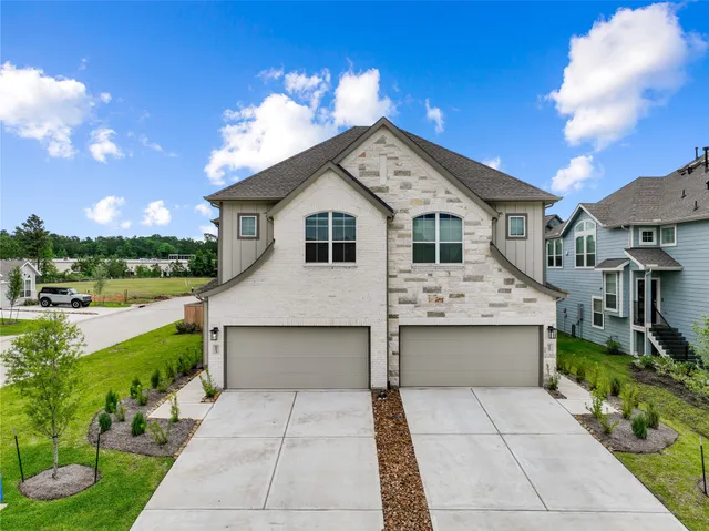 a front view of a house with yard