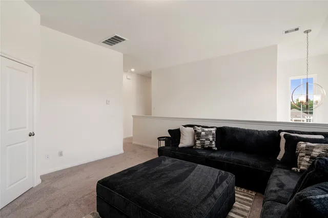 a living room with furniture and a couch