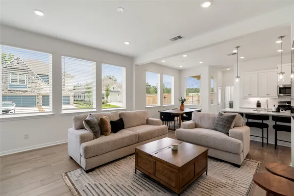 a living room with furniture and a large window