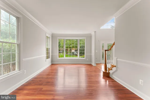 a very nice looking room with a bed furniture and a wooden floor
