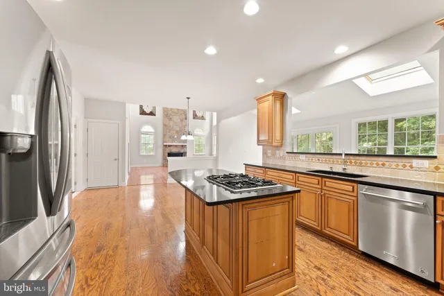 a bathroom with a toilet a sink and a mirror