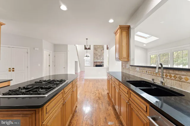 a bathroom with a sink toilet and a mirror