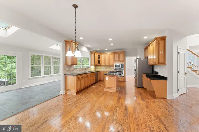 a bathroom with a bathtub a sink and a window