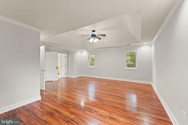 a front view of a house with a yard table and chairs