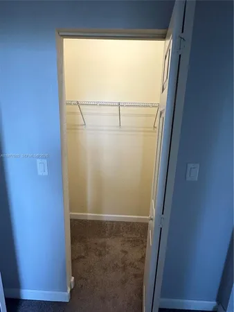 a bathroom with a bathtub sink and mirror