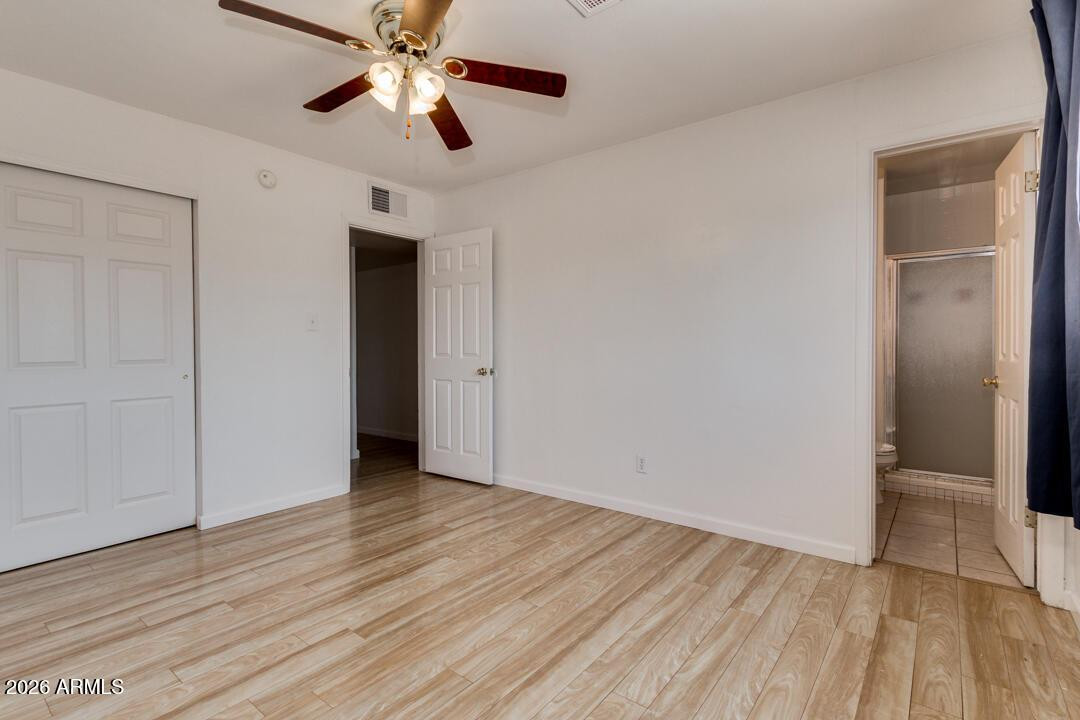 1308 West 6th Street Tempe, AZ 85281 - Photo 15 of 27 a view of an empty room with wooden floor
