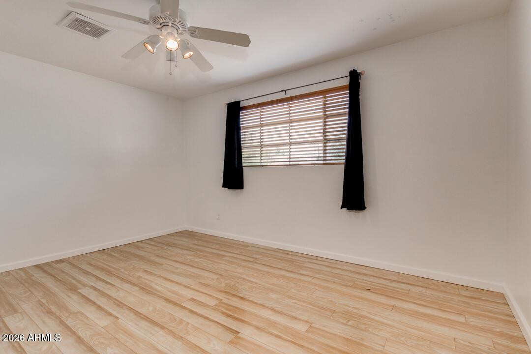 1308 West 6th Street Tempe, AZ 85281 - Photo 20 of 27 wooden floor in an empty room with a window