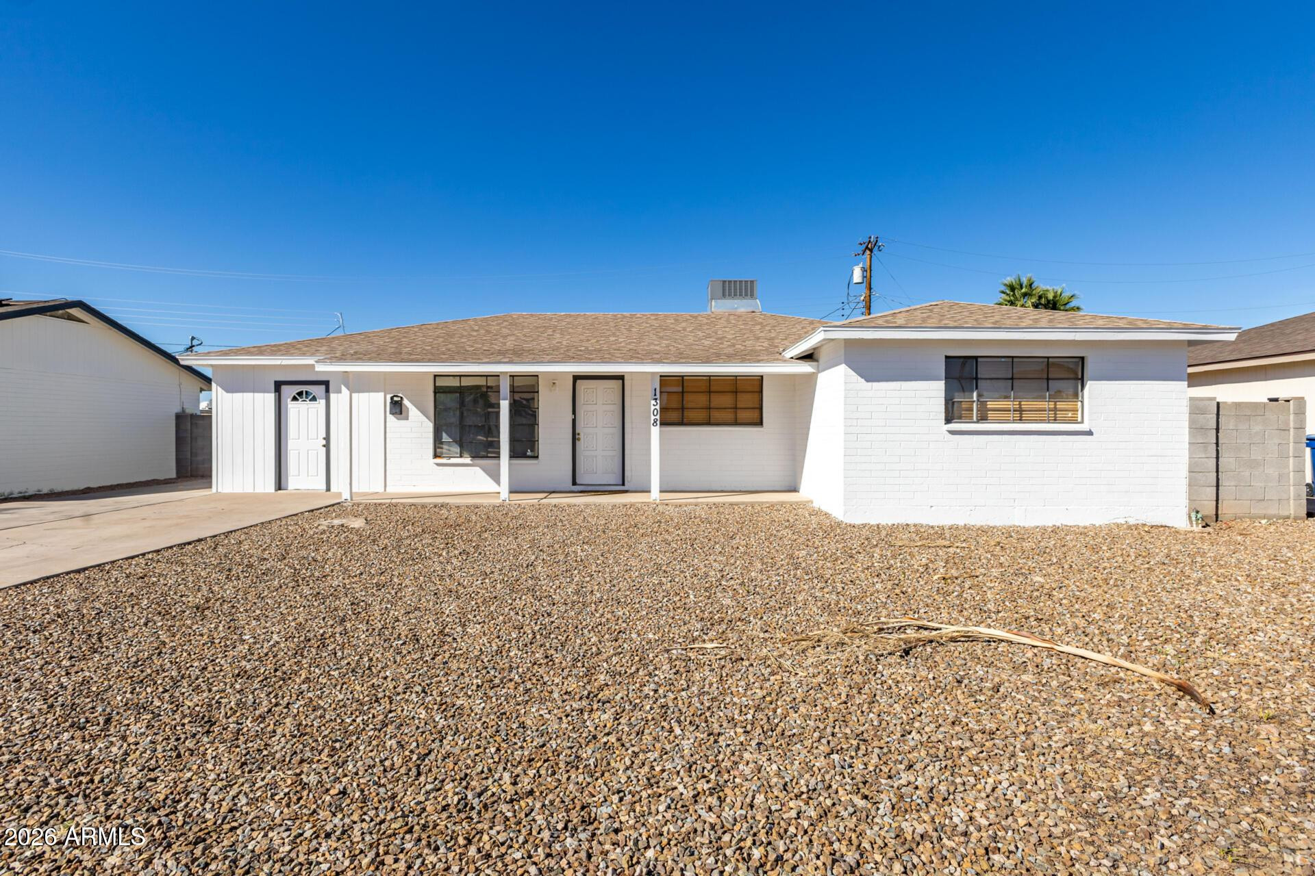 1308 West 6th Street Tempe, AZ 85281 - Photo 2 of 27 a front view of a house with a yard