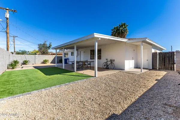 a view of a house with backyard porch and garden
