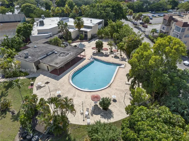 an aerial view of a house with outdoor space swimming pool and lake view
