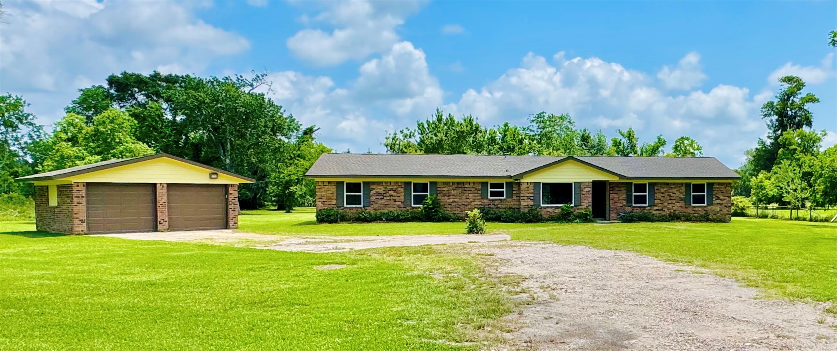 1434 County Road 878A Sweeny, TX 77480 - Photo 4 of 36 a front view of a house with a yard and trees
