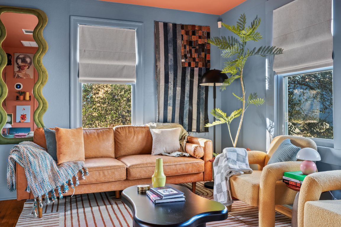 96 Lynn Street Austin, TX 78702 - Photo 1 of 1 a living room with furniture a lamp and a large window