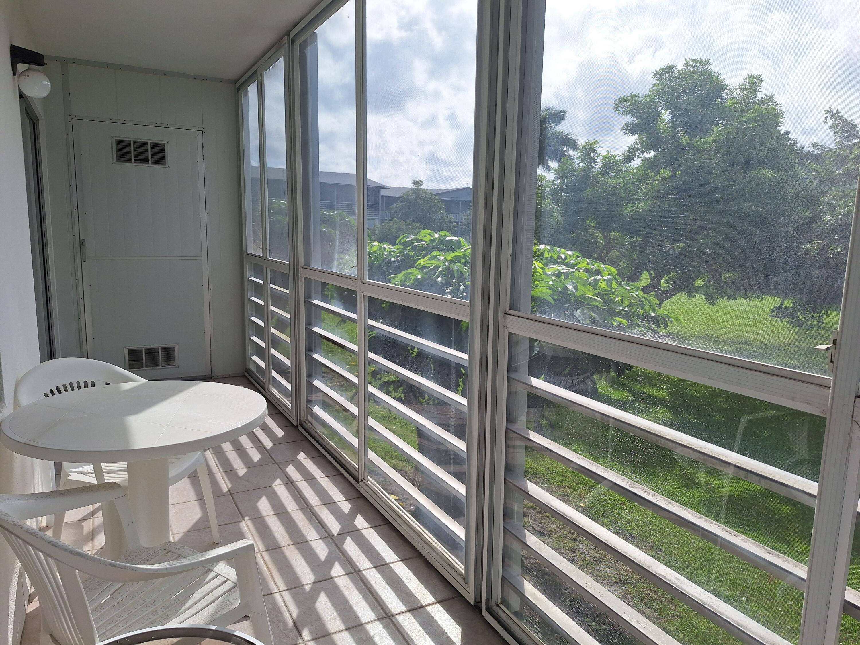 154 Suffolk F Boca Raton, FL 33434 - Photo 12 of 32 lanai with table