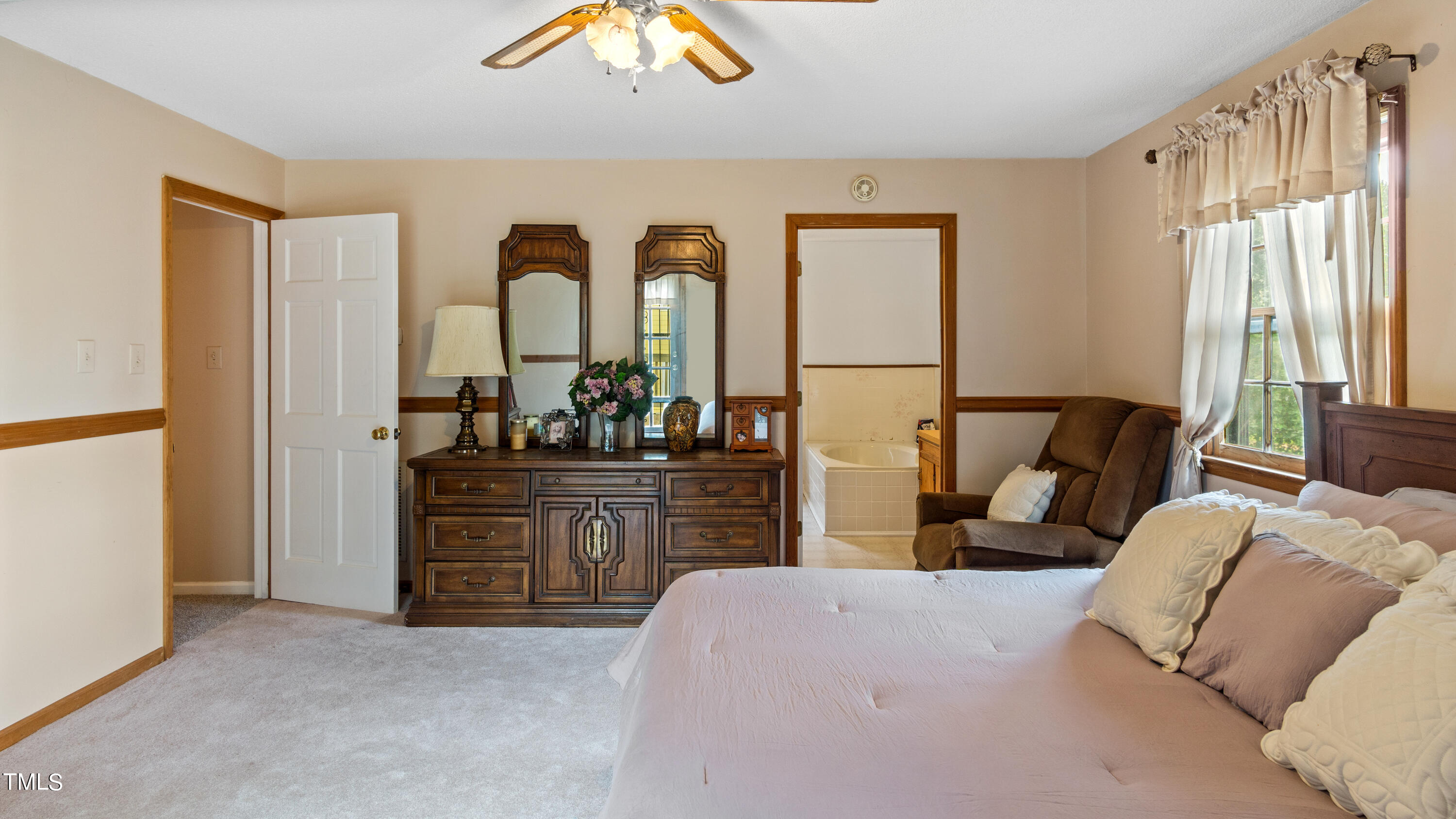 125 Walter Street Manson, NC 27553 - Photo 12 of 39 a living room with furniture and large windows