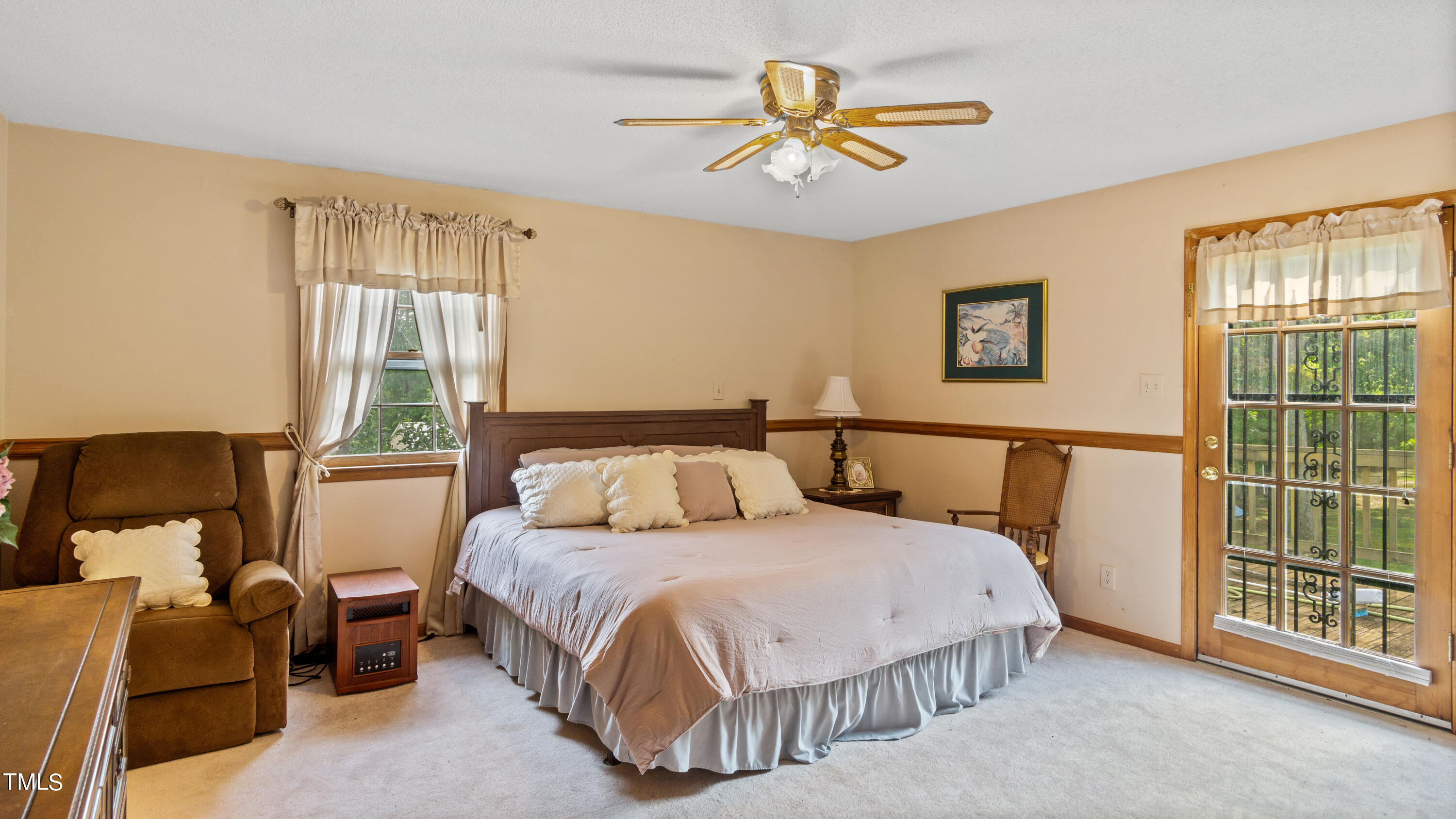 125 Walter Street Manson, NC 27553 - Photo 13 of 39 a bedroom with a bed a couch and a window