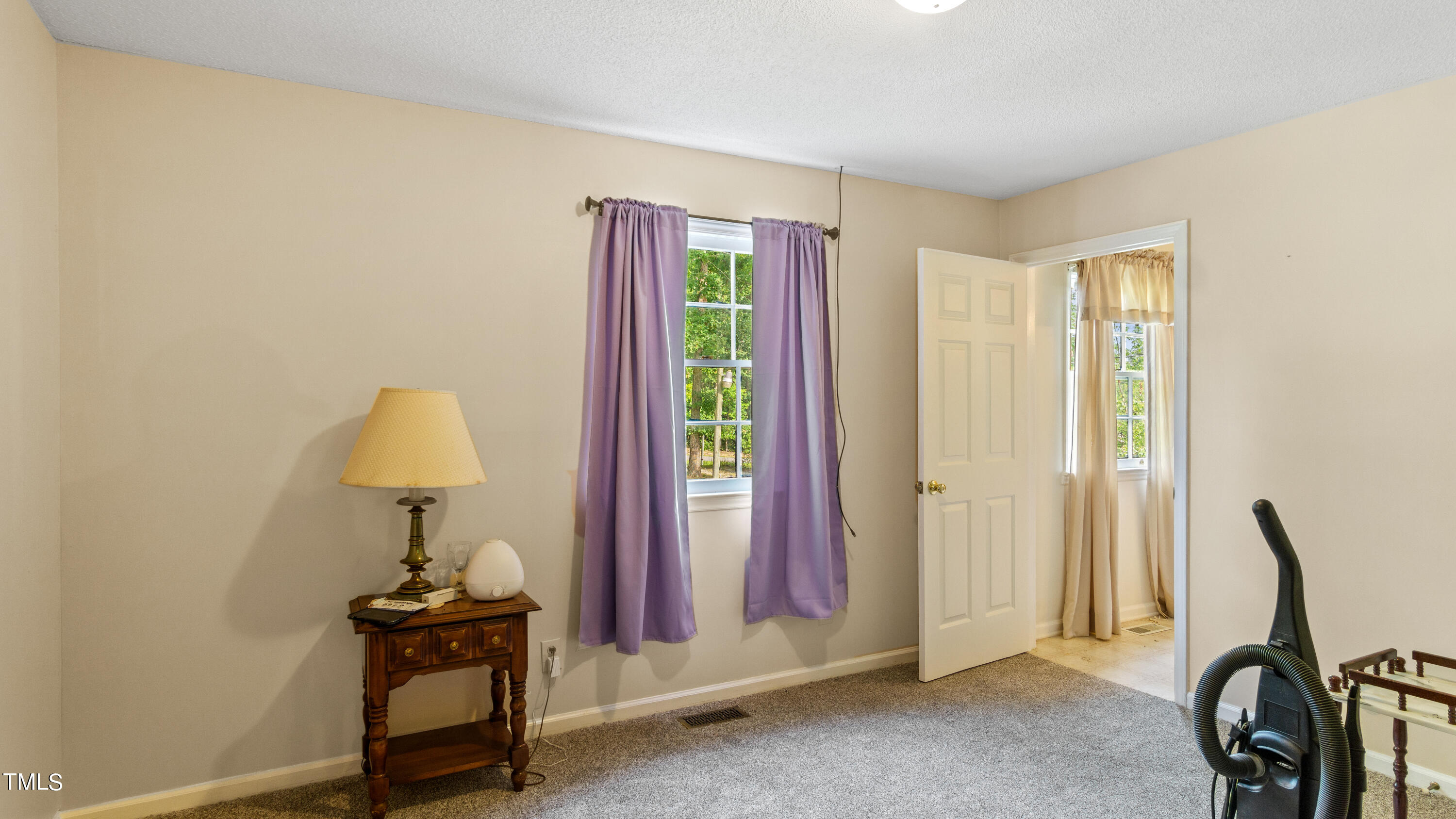 125 Walter Street Manson, NC 27553 - Photo 16 of 39 a view of a room with a window and a chair