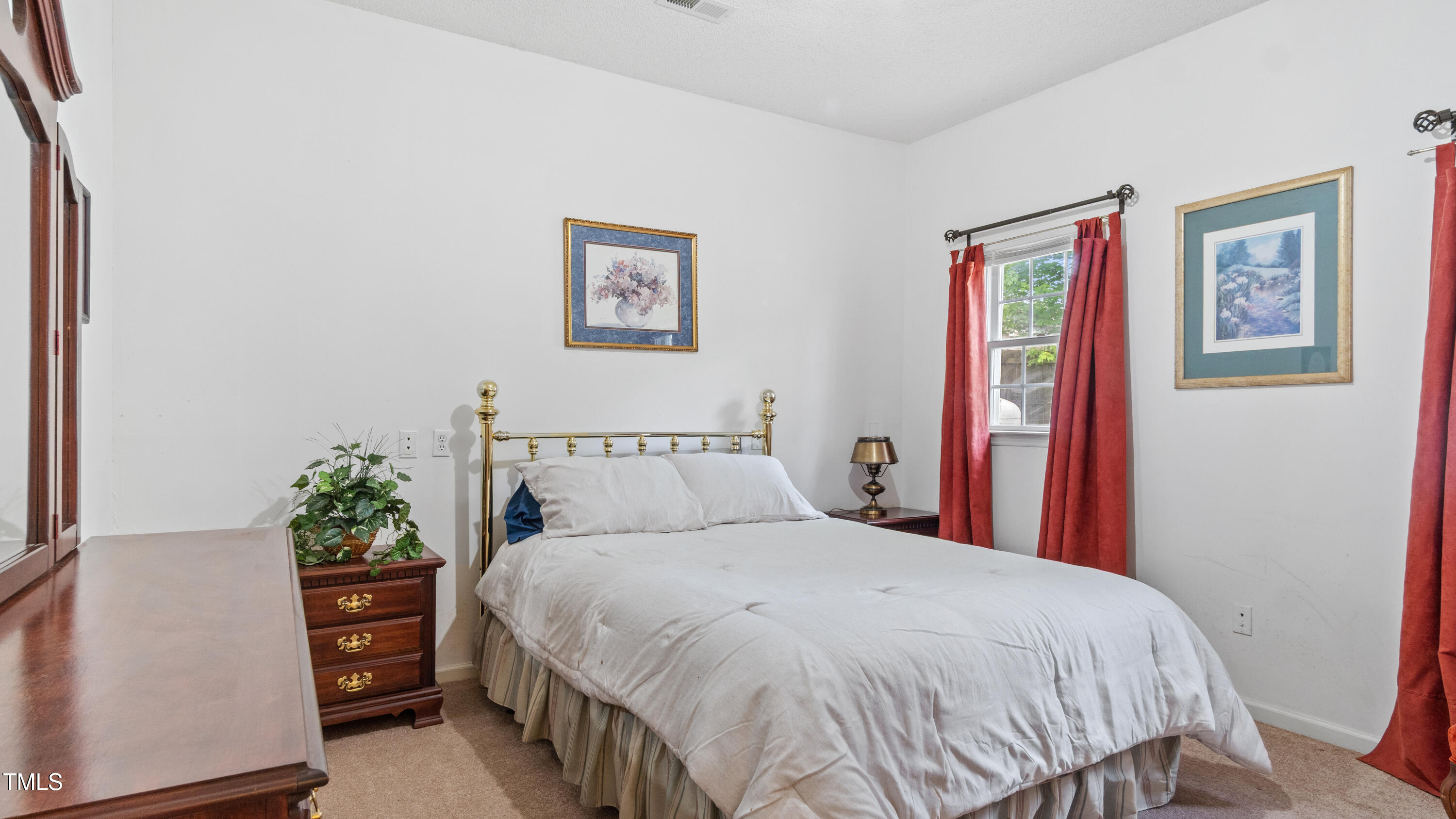 125 Walter Street Manson, NC 27553 - Photo 19 of 39 a bed sitting in a bedroom next to a window