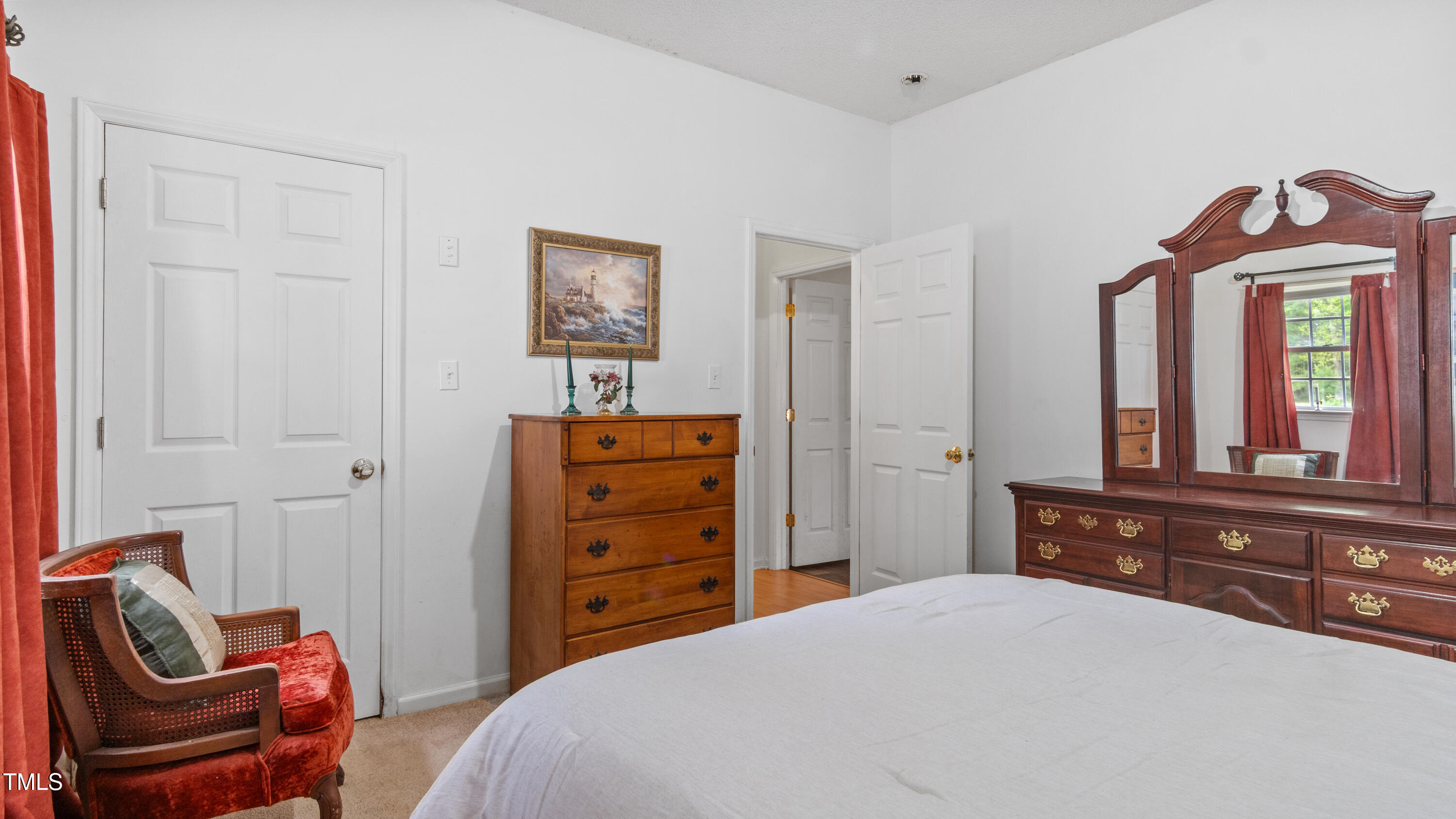 125 Walter Street Manson, NC 27553 - Photo 21 of 39 a bedroom with a bed and a mirror on dresser