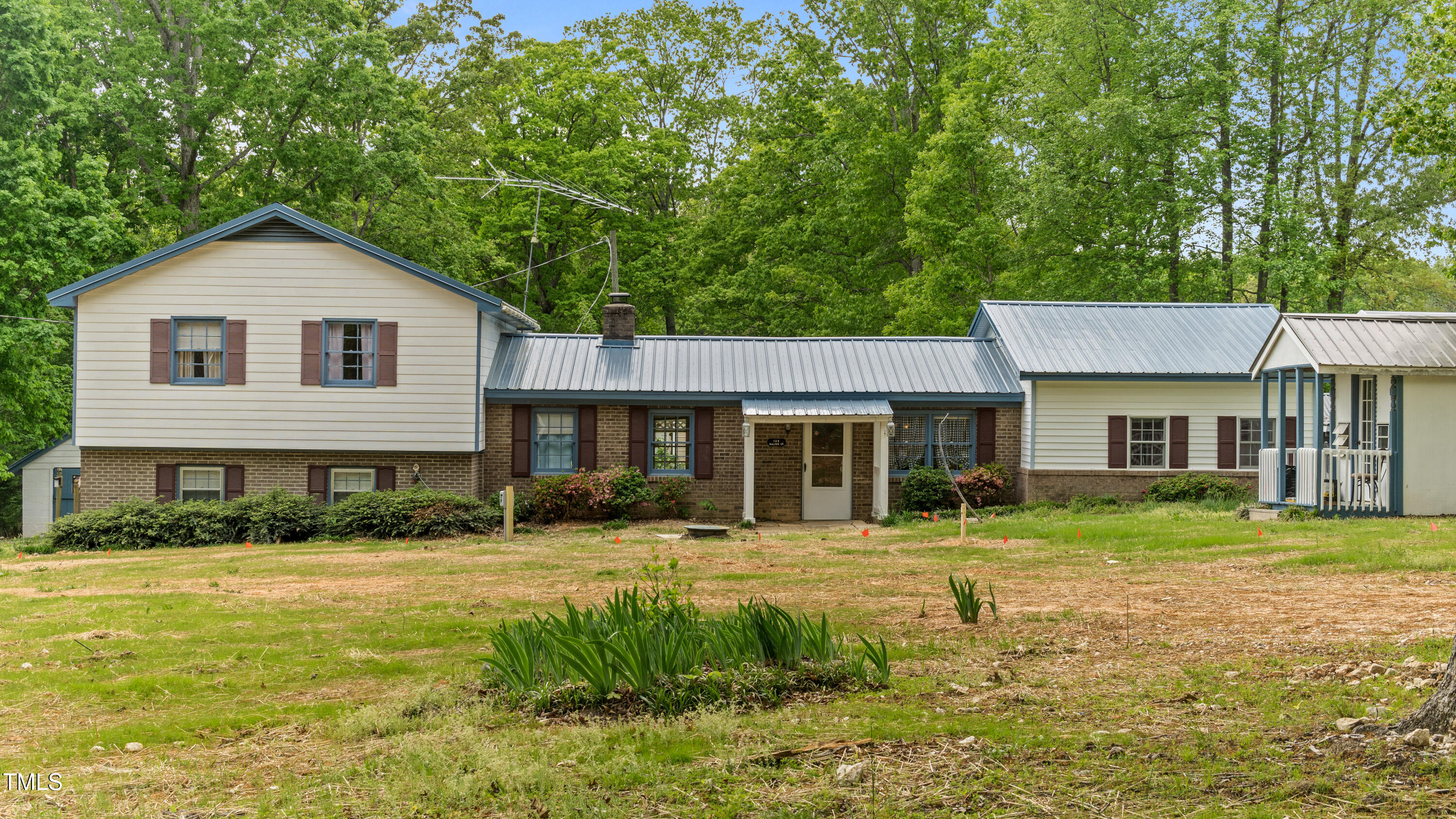 125 Walter Street Manson, NC 27553 - Photo 31 of 39 a front view of a house with a yard