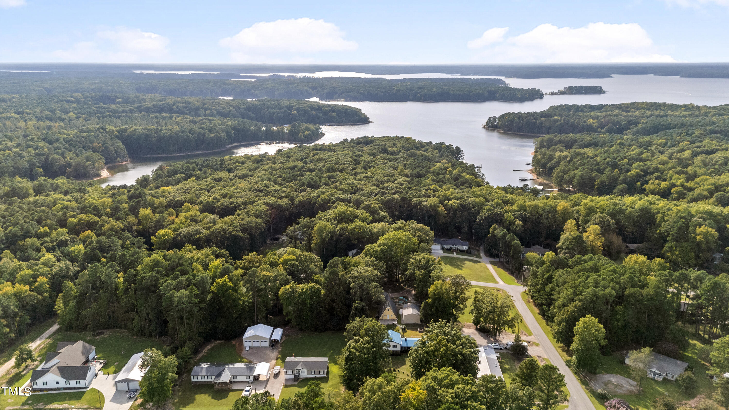 125 Walter Street Manson, NC 27553 - Photo 37 of 39 a view of a lake with a mountain