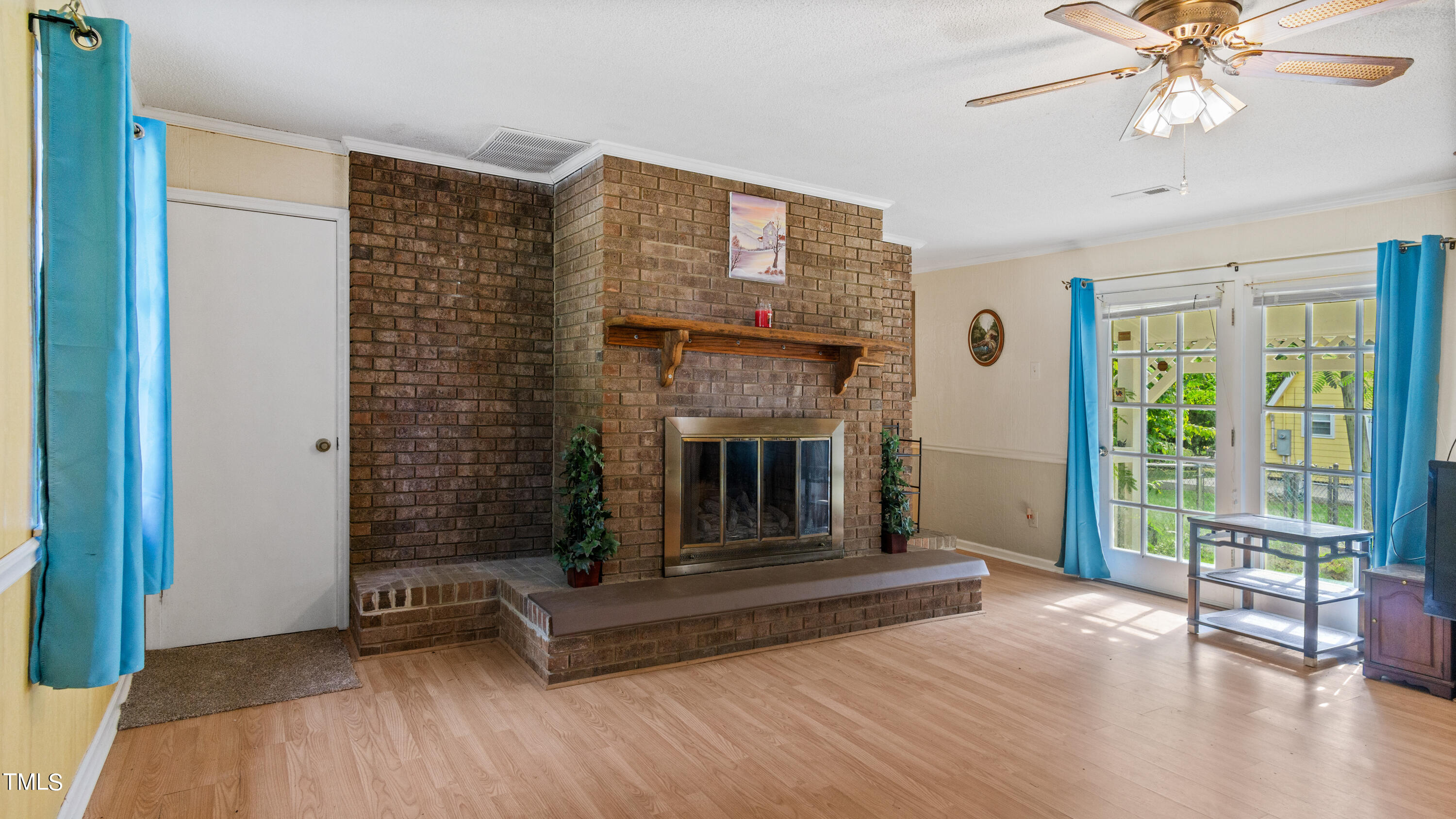 125 Walter Street Manson, NC 27553 - Photo 4 of 39 a living room with furniture and a fireplace