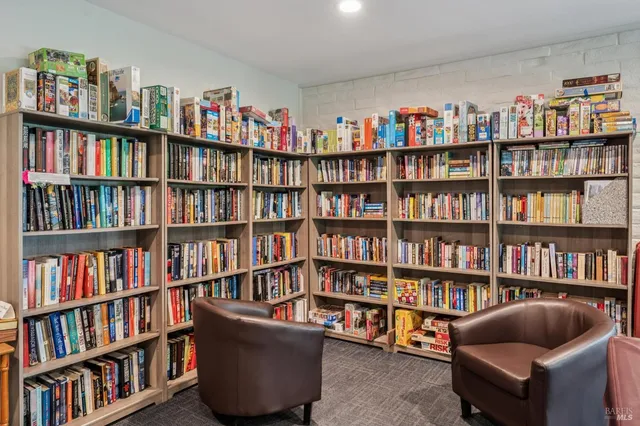 a kitchen with stainless steel appliances granite countertop a refrigerator a stove a sink dishwasher and a refrigerator with wooden floor