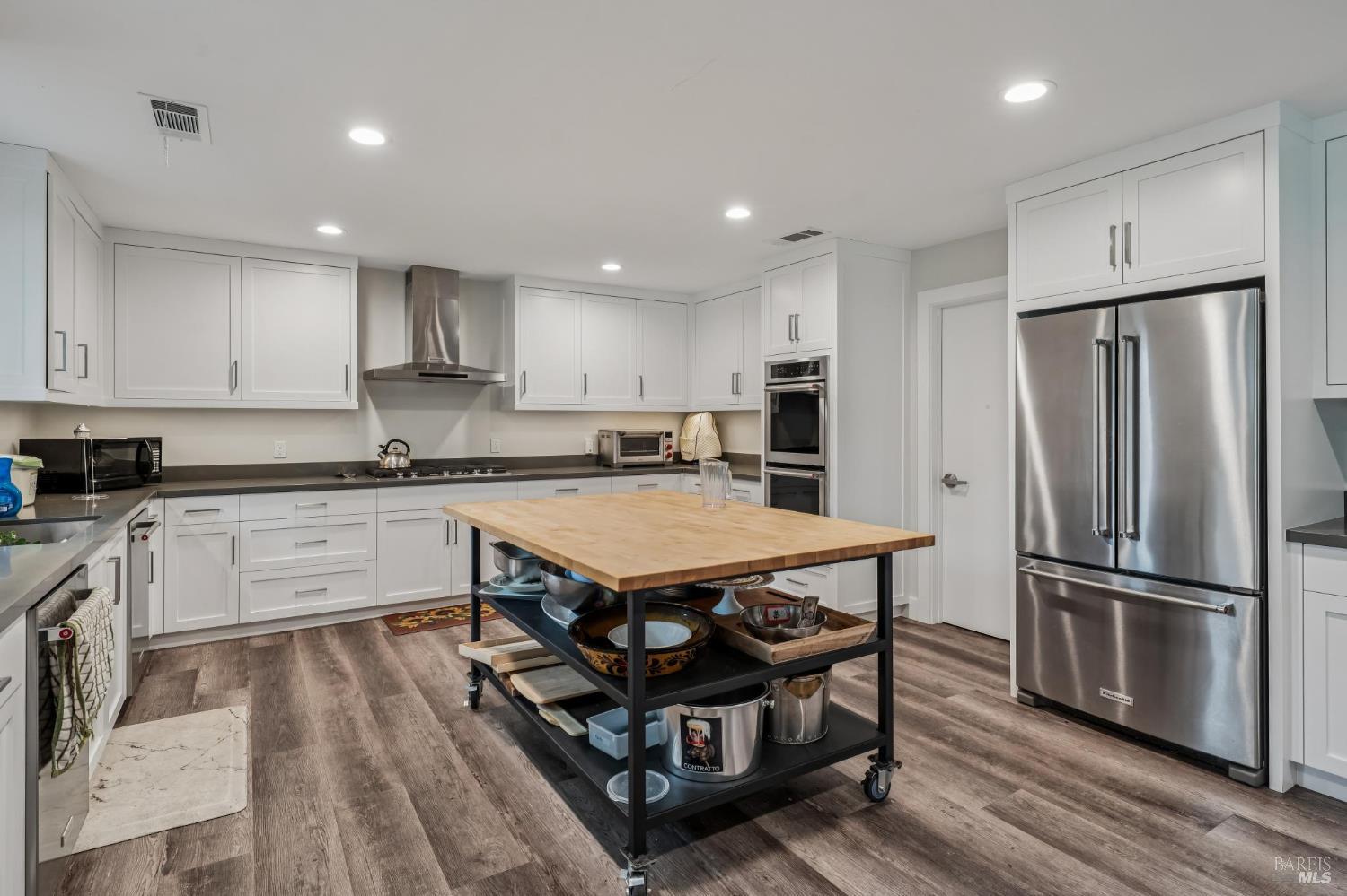 109 Merida Drive Sonoma, CA 95476 - Photo 20 of 20 a kitchen with stainless steel appliances granite countertop a refrigerator a stove a sink dishwasher and a refrigerator with wooden floor
