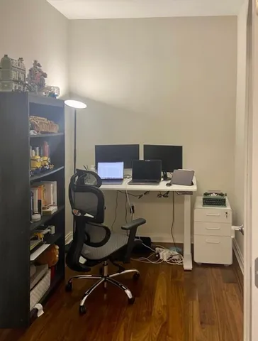 a view of workspace with wooden floor