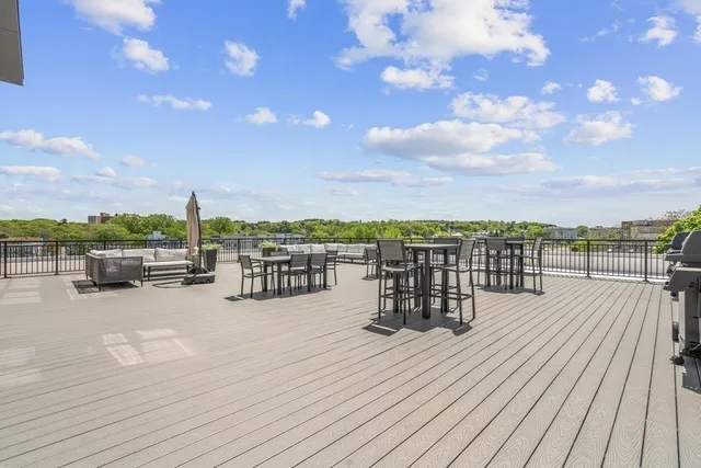 a view of roof deck with patio