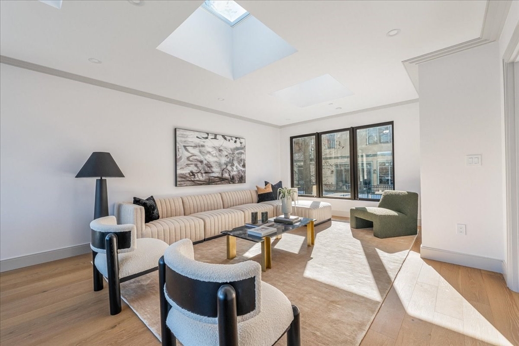 57 University Road, Unit PH Brookline, MA 02445 - Photo 18 of 23 a living room with furniture and a large window