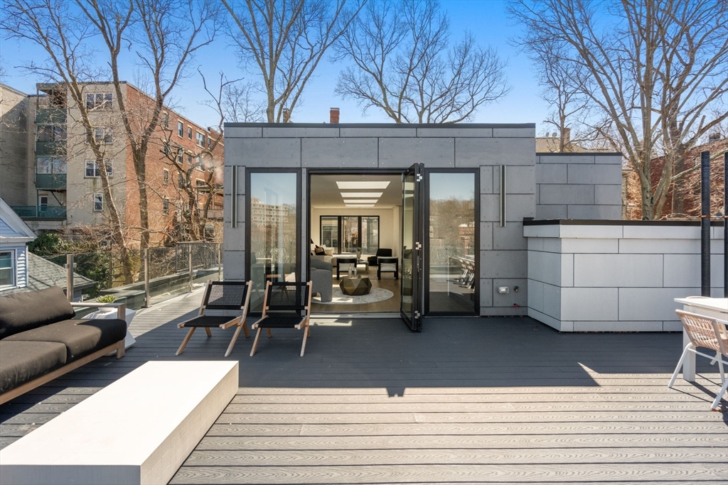 57 University Road, Unit PH Brookline, MA 02445 - Photo 2 of 23 a building outdoor space with a couch