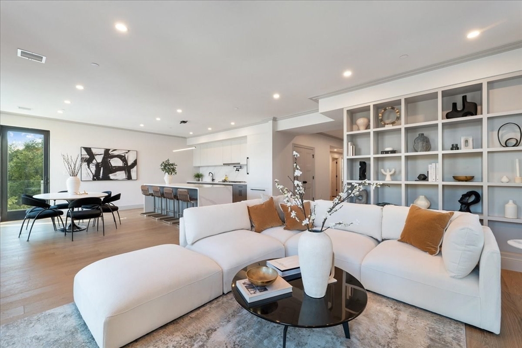 57 University Road, Unit PH Brookline, MA 02445 - Photo 4 of 23 a living room with furniture and a large window