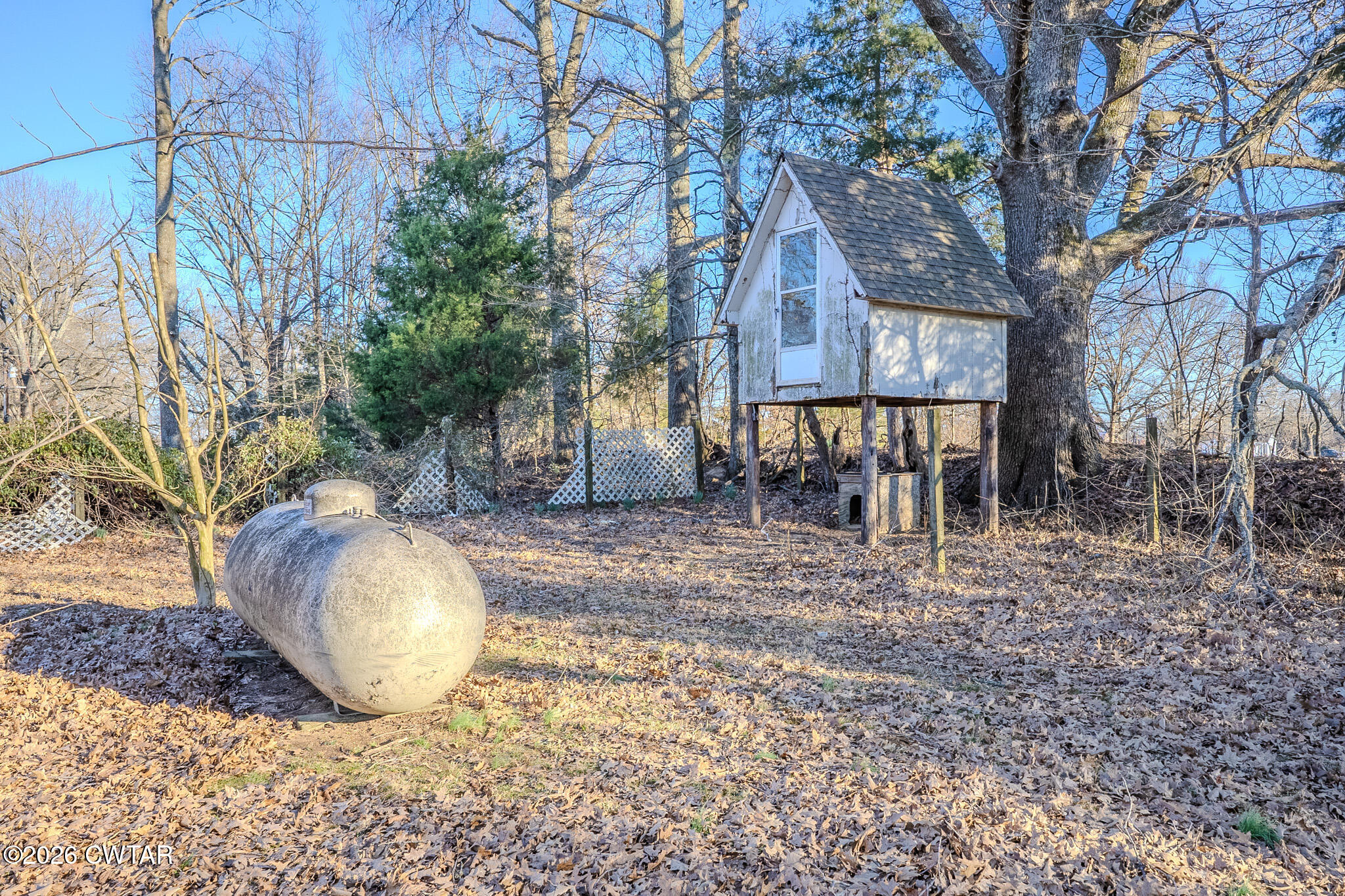 3559 Union Mercer Road Brownsville, TN 38012 - Photo 19 of 24 a view of a backyard with table and chairs and wooden fence