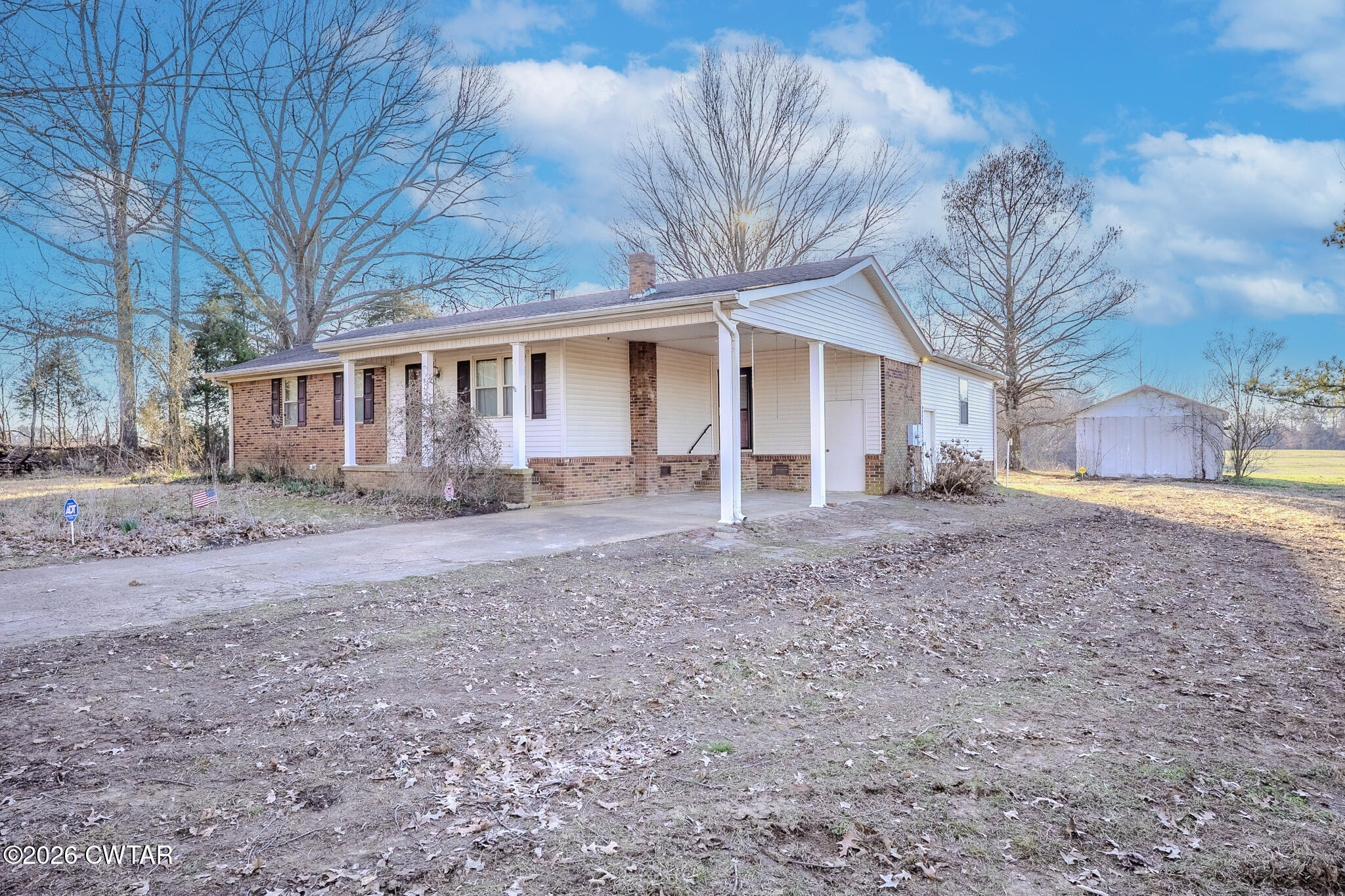 3559 Union Mercer Road Brownsville, TN 38012 - Photo 24 of 24 a view of a house with a yard covered in the forest