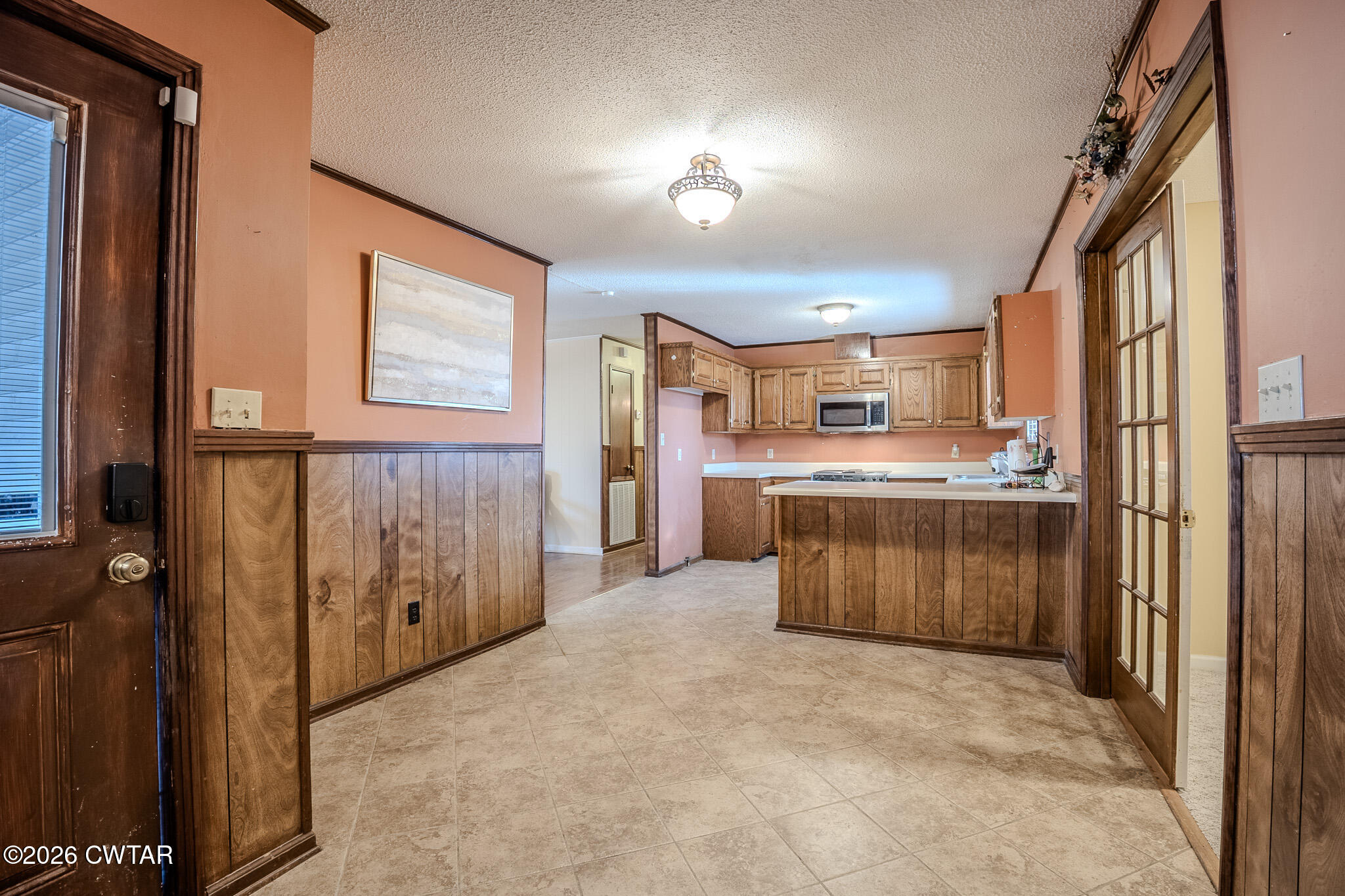3559 Union Mercer Road Brownsville, TN 38012 - Photo 7 of 24 a open kitchen with a refrigerator a stove top oven a sink and dishwasher