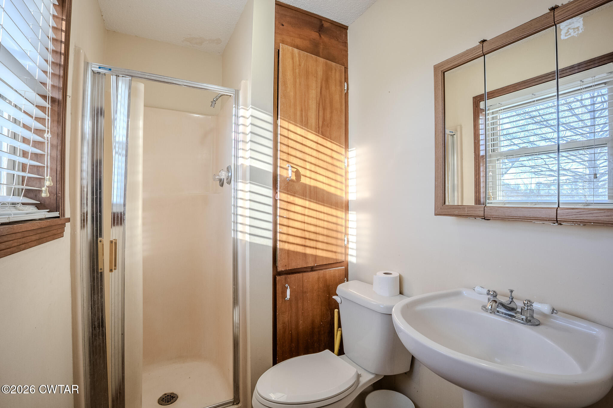 3559 Union Mercer Road Brownsville, TN 38012 - Photo 9 of 24 a bathroom with a sink a toilet and shower