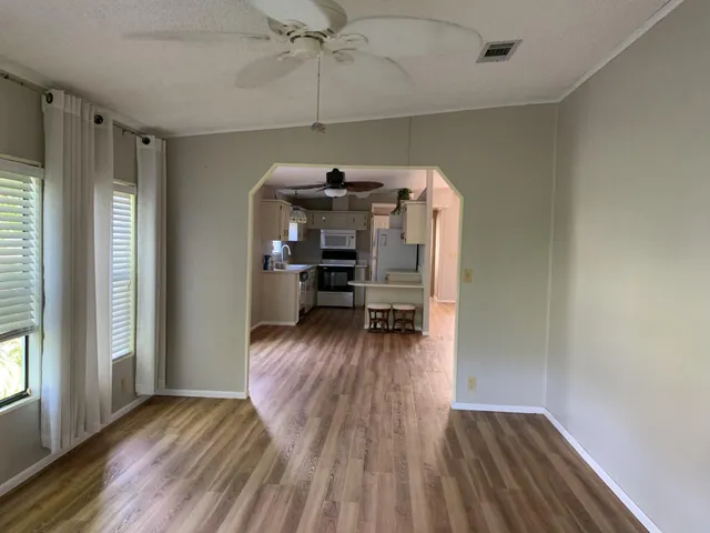 a view of an empty room with a large window